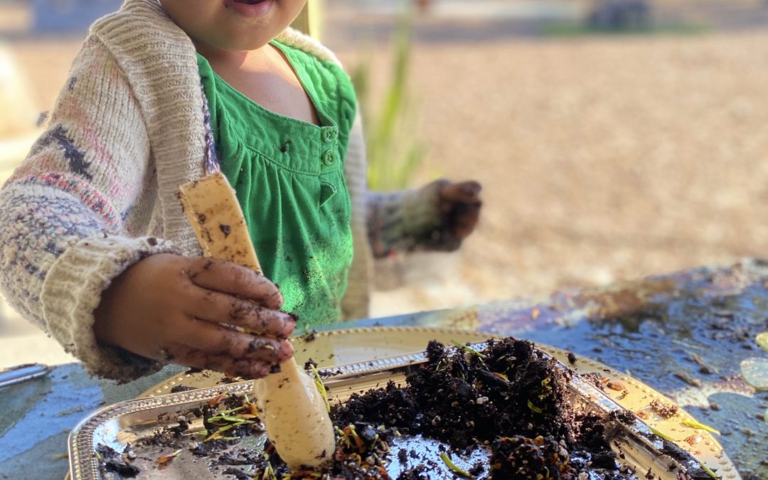 girl playing with dirt